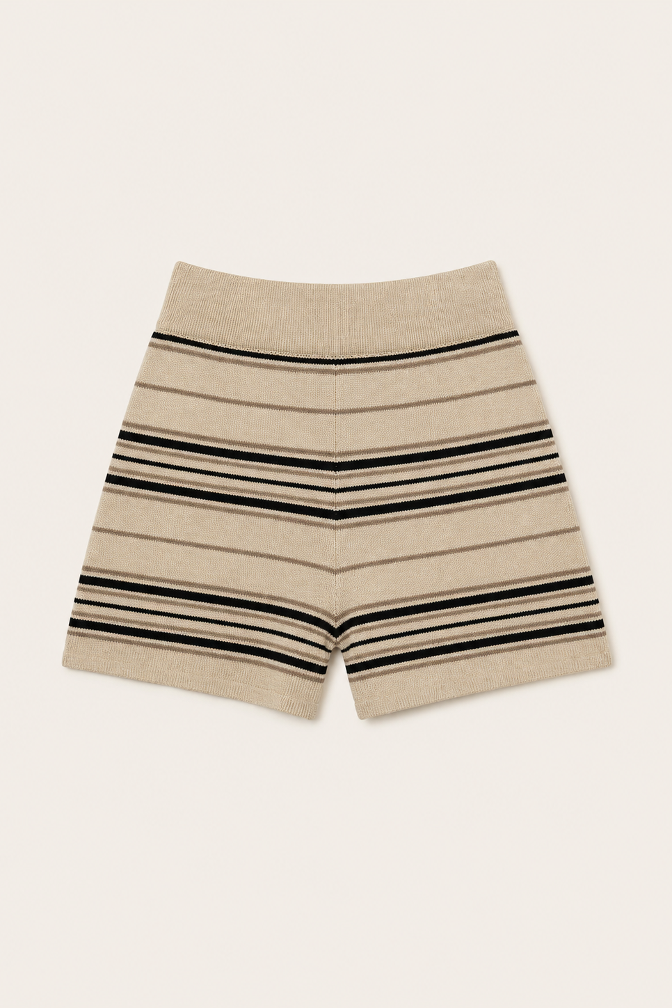 A pair of beige knit shorts with horizontal black and dark brown stripes, laid flat against a light cream background.